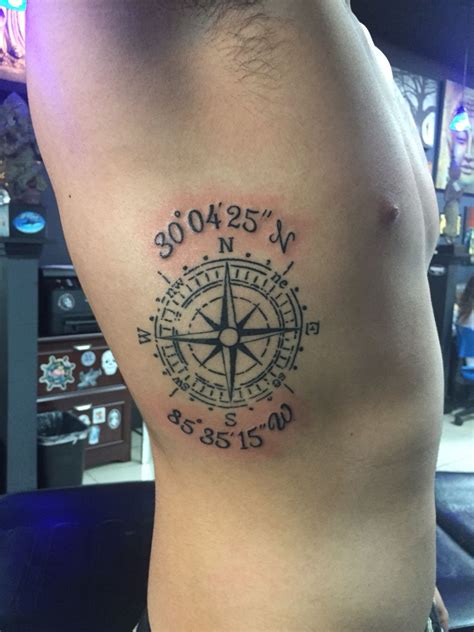Compass tattoo with son's coordinates